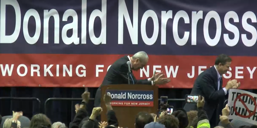 Murphy, left, and Norcross simultaneously bow in the direction of Pelosi.