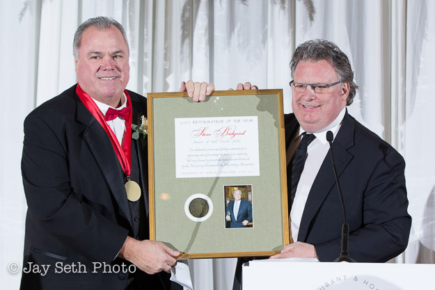 Burke gives Bidgood the restaurant award.